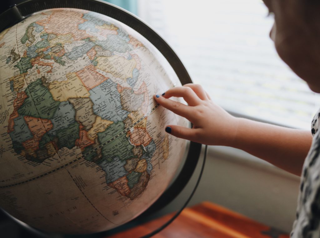 Private tutors availability globally during coronavirus pandemic: child points at globe